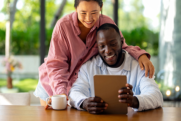 Man and women looking at a tablet