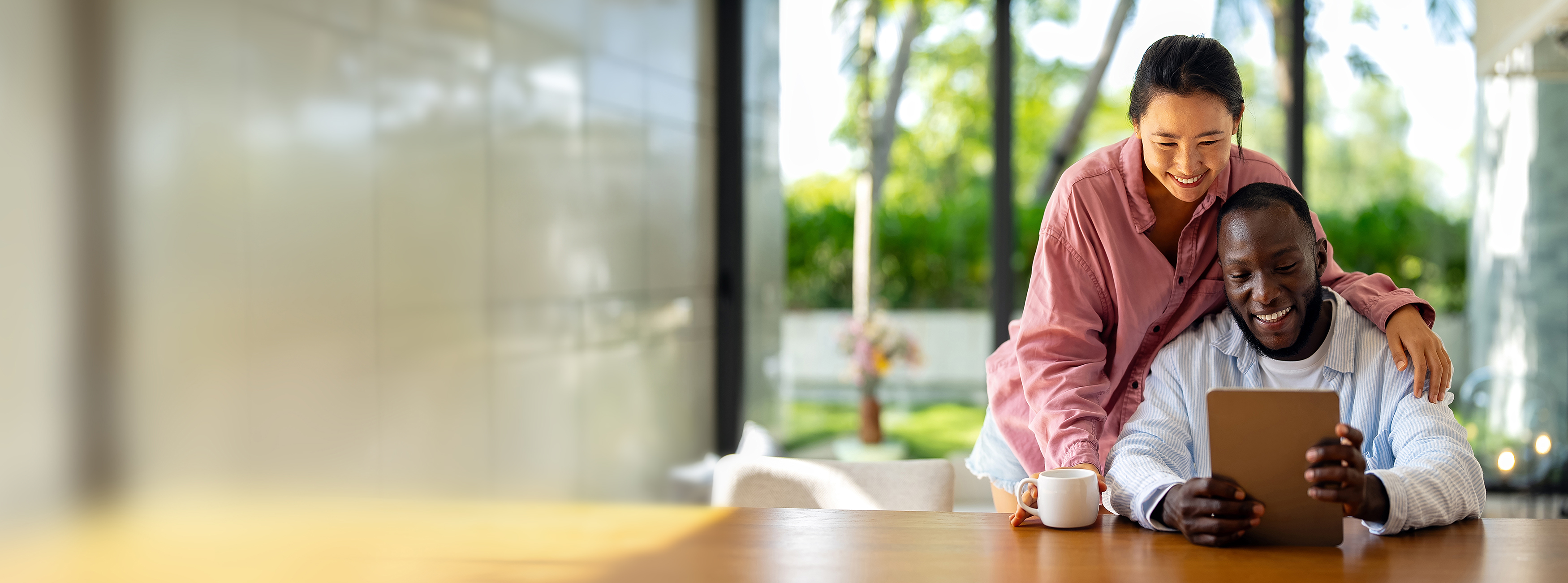 young couple looking at a tablet