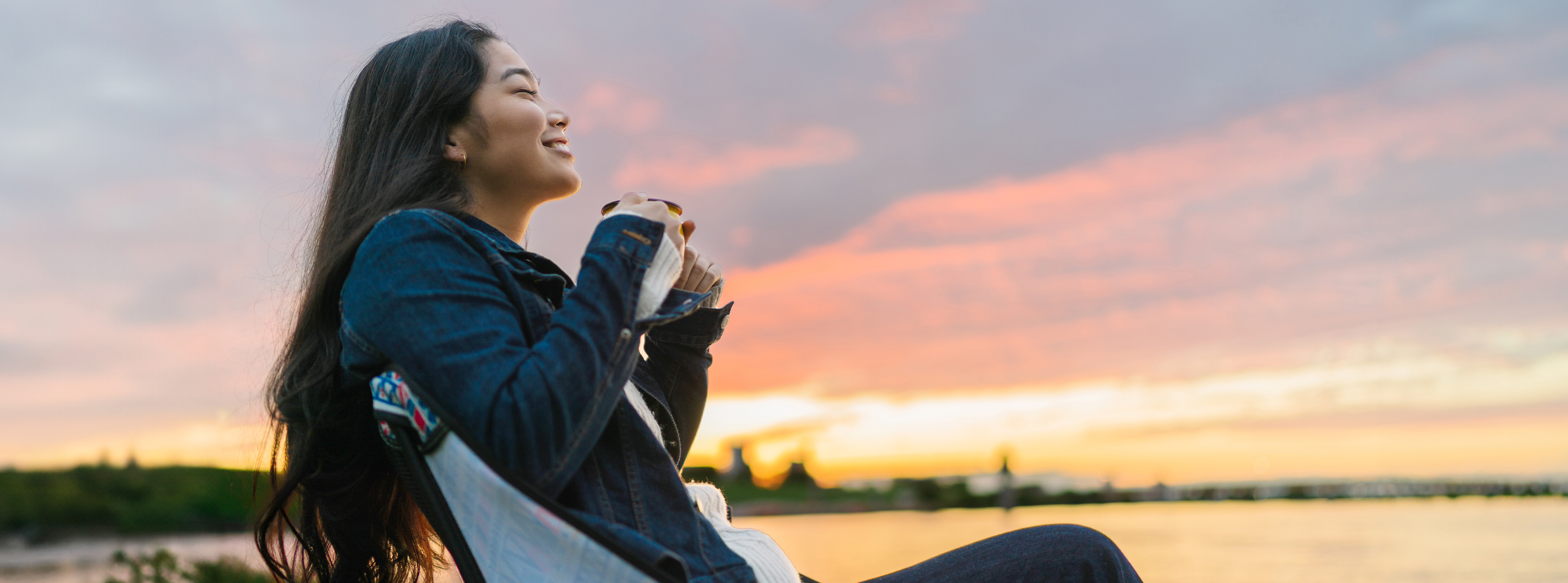 person outside with the sun setting